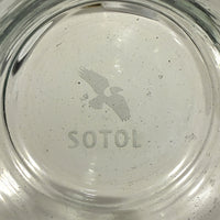 Los Magos bird logo and the word SOTOL etched into the base of the rocks glass
